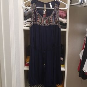 Navy romper with embroidered detailing